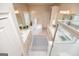 Elegant bathroom with dual sinks, a corner tub, a walk-in shower, and custom cabinetry at 713 Birkdale Blvd, Carrollton, GA 30116