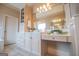 Bright bathroom featuring custom cabinets and drawers, vanity, and a large mirror at 713 Birkdale Blvd, Carrollton, GA 30116