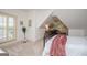 Bedroom featuring sloped ceilings, a window seat, and a decorative window that adds charm to the space at 713 Birkdale Blvd, Carrollton, GA 30116