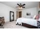 Spacious bedroom featuring a full-length mirror, light walls, and plush carpeting at 713 Birkdale Blvd, Carrollton, GA 30116
