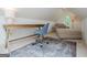 Attic office space includes desk, chair, and an arched window above a daybed that adds charm to the space at 713 Birkdale Blvd, Carrollton, GA 30116