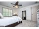 Bright bedroom with plantation shutters, plush carpet, and a ceiling fan for added comfort at 713 Birkdale Blvd, Carrollton, GA 30116
