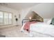 Cozy bedroom featuring sloped ceilings, a window seat, and a decorative window that adds charm to the space at 713 Birkdale Blvd, Carrollton, GA 30116