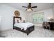 Cozy bedroom featuring neutral tones, natural light from the window, and soft carpet at 713 Birkdale Blvd, Carrollton, GA 30116