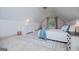 Bright attic bedroom with a sloped ceiling, soft carpet, and ample natural light at 713 Birkdale Blvd, Carrollton, GA 30116
