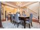 Formal dining room showcasing hardwood floors, a chandelier, and easy access to living spaces at 713 Birkdale Blvd, Carrollton, GA 30116