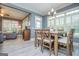 Bright dining area with light wood floors and a view to the adjacent living room at 713 Birkdale Blvd, Carrollton, GA 30116