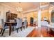 Elegant dining room featuring hardwood floors, chandelier, and access to the living room at 713 Birkdale Blvd, Carrollton, GA 30116