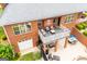 The home has a covered patio with comfortable seating and lush landscaping at 713 Birkdale Blvd, Carrollton, GA 30116