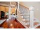 Open foyer showcases hardwood floors, staircase with iron spindles, and entry to living room at 713 Birkdale Blvd, Carrollton, GA 30116