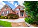 Inviting brick home featuring a landscaped front yard with a beautiful walkway to the front door at 713 Birkdale Blvd, Carrollton, GA 30116