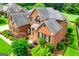 Beautiful two-story brick home featuring a manicured front yard with lush landscaping at 713 Birkdale Blvd, Carrollton, GA 30116