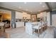 Spacious kitchen with white cabinets, stainless appliances, view of a dining area, and grey walls at 713 Birkdale Blvd, Carrollton, GA 30116