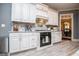 Updated kitchen with white cabinets, stainless appliances, and grey walls, for a stylish feel at 713 Birkdale Blvd, Carrollton, GA 30116