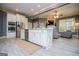 Open kitchen featuring white cabinetry, a central island, and views into the living room at 713 Birkdale Blvd, Carrollton, GA 30116