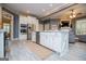 Bright, open kitchen featuring white cabinetry, a large island, and stainless steel appliances at 713 Birkdale Blvd, Carrollton, GA 30116