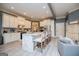 Bright kitchen with white cabinetry, a large island, and stylish bar seating at 713 Birkdale Blvd, Carrollton, GA 30116