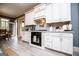 Bright kitchen with white cabinets, stainless appliances, and a view to the breakfast area at 713 Birkdale Blvd, Carrollton, GA 30116