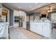 A stylish kitchen boasts white cabinetry, stainless steel appliances, and an open design concept at 713 Birkdale Blvd, Carrollton, GA 30116