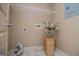 Functional laundry area with shelving and connections, ready for appliances at 713 Birkdale Blvd, Carrollton, GA 30116