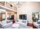 Open concept living room with a view into dining room and balcony at 713 Birkdale Blvd, Carrollton, GA 30116