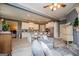 Open concept with kitchen views, the living room features a brick fireplace and modern furnishings at 713 Birkdale Blvd, Carrollton, GA 30116