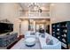 Spacious living room with soaring ceilings, chandelier, open to dining room and second floor at 713 Birkdale Blvd, Carrollton, GA 30116