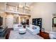 Open living space with view of chandelier, dining room, and second-story balcony at 713 Birkdale Blvd, Carrollton, GA 30116