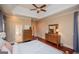 Comfortable main bedroom featuring hardwood floors and a view to the ensuite bathroom at 713 Birkdale Blvd, Carrollton, GA 30116