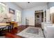 Spacious office featuring hardwood floors, wainscoting, and an antique area rug at 713 Birkdale Blvd, Carrollton, GA 30116