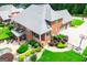 Beautiful in-ground pool surrounded by landscaping, wrought iron fence, and patio area at 713 Birkdale Blvd, Carrollton, GA 30116