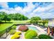 Secluded backyard oasis with an in-ground pool, lush landscaping, and plenty of room for entertaining at 713 Birkdale Blvd, Carrollton, GA 30116