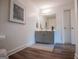 Stylish powder room with updated vanity, decor, framed mirror, and modern lighting at 713 Birkdale Blvd, Carrollton, GA 30116