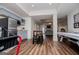 Spacious finished basement featuring an air hockey table, tv, and kitchen area, perfect for entertaining at 713 Birkdale Blvd, Carrollton, GA 30116