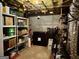 Unfinished basement with shelving, storage and exposed ceiling at 360 Morgan Mill Rd, Brooks, GA 30205