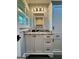 Bright bathroom featuring modern vanity with granite countertops and natural light from the shutters at 360 Morgan Mill Rd, Brooks, GA 30205
