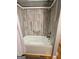 Bathroom with a shower over tub, grab bar, and modern tiling at 360 Morgan Mill Rd, Brooks, GA 30205