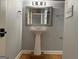 Bathroom with a pedestal sink and mirror at 360 Morgan Mill Rd, Brooks, GA 30205