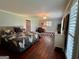 Bright primary bedroom featuring hardwood floors, natural light and door to walk-in closet at 360 Morgan Mill Rd, Brooks, GA 30205