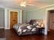 Charming bedroom featuring hardwood floors, neutral paint and closet doors at 360 Morgan Mill Rd, Brooks, GA 30205