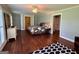 Bright bedroom featuring hardwood floors, natural light from the shutters and doors to walk-in closet at 360 Morgan Mill Rd, Brooks, GA 30205