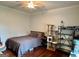 Bright bedroom featuring hardwood floors, soft lighting, decor displays, and modern shelving for storage at 360 Morgan Mill Rd, Brooks, GA 30205