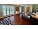 Comfortable bedroom featuring hardwood floors and natural light from the shutters at 360 Morgan Mill Rd, Brooks, GA 30205