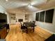 Bonus room with a ceiling fan, hardwood floors, brick fireplace, and built-in shelving at 360 Morgan Mill Rd, Brooks, GA 30205