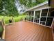 Relaxing deck area with views of the backyard and screened-in porch at 360 Morgan Mill Rd, Brooks, GA 30205