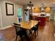 Cozy dining area with wooden table and chairs next to the kitchen at 360 Morgan Mill Rd, Brooks, GA 30205