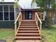 Back of house showcasing a brick exterior and access to the screened-in porch at 360 Morgan Mill Rd, Brooks, GA 30205