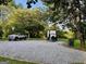 Exterior shot featuring a truck and a trailer parked on gravel at 360 Morgan Mill Rd, Brooks, GA 30205