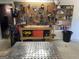 Well-organized garage workshop area with pegboard, tools, and workbench at 360 Morgan Mill Rd, Brooks, GA 30205