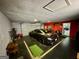 Garage includes a car and is painted grey with an interior entrance door at 360 Morgan Mill Rd, Brooks, GA 30205